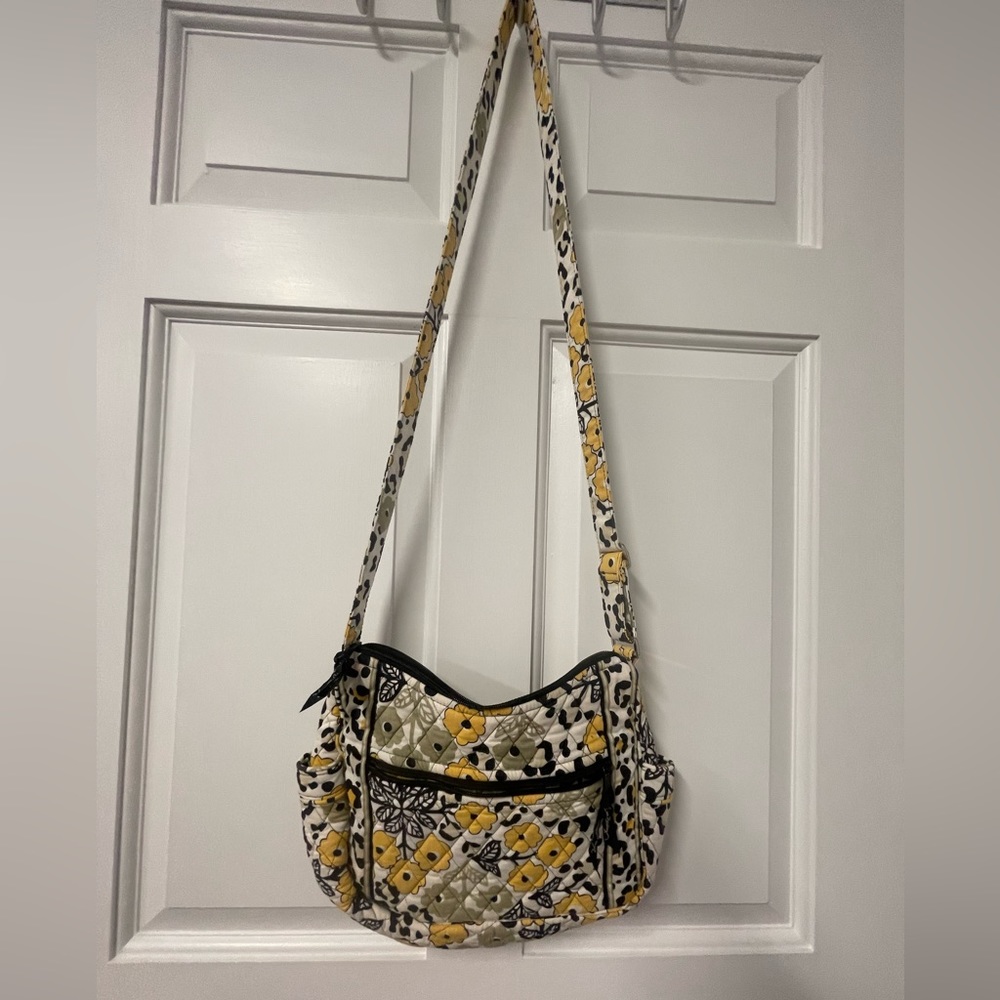 Excellent used condition Vera Bradley floral and cheetah print yellow crossbody
